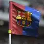 A corner flag with the badge of FC Barcelona flies during the 58th Joan Gamper Trophy football match between FC Barcelona and Tottenham Hotspur FC at the Estadi Olimpic Lluis Companys in Barcelona on August 8, 2023. (Photo by Pau BARRENA / AFP)
