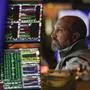 FILE - Traders work on the floor at the New York Stock Exchange in New York, Tuesday, Oct. 4, 2022. Companies across the S&P 500 are expected to report the biggest drop in earnings since the spring of 2020 when first-quarter results begin rolling out this week. The only question for many on Wall Street is how much worse they will get. Still-high inflation, a struggling manufacturing industry and signs of slowdown elsewhere in the economy mean analysts expect S&P 500 companies to report a 6.6% drop in earnings per share from a year earlier.  (AP Photo/Seth Wenig, File)