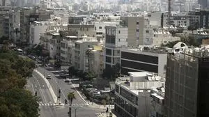 A general view shows the mostly empty streets near Tel Aviv's beachfront, Friday, June 13, 2025. (AP Photo/Leo Correa)