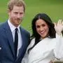 (FILES) In this file photo taken on November 27, 2017 Britain's Prince Harry and his fiancée US actress Meghan Markle pose for a photograph in the Sunken Garden at Kensington Palace in west London, following the announcement of their engagement. - Britain's Prince Harry and his wife Meghan will step back as senior members of the royal family and spend more time in North America, the couple said in a historic statement Wednesday. (Photo by Daniel LEAL-OLIVAS / AFP)