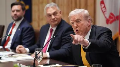 President Donald Trump, from right, meets with Hungary's Prime Minister Viktor Orban as Vice President JD Vance listens in the Cabinet Room of the White House, Friday, Nov. 7, 2025, in Washington. (AP Photo/Evan Vucci)