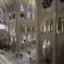 FILE - People stroll in Notre-Dame de Paris cathedral while French President Emmanuel Macron visits the restored interiors the monument, Friday, Nov.29, 2024 in Paris. (Christophe Petit Tesson, Pool via AP, File)