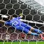 Austria's goalkeeper #13 Patrick Pentz dives to save a shot during the UEFA Euro 2024 Group D football match between Poland and Austria at the Olympiastadion in Berlin on June 21, 2024. (Photo by JOHN MACDOUGALL / AFP)