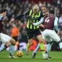 Manchester City's Norwegian striker #09 Erling Haaland (C) vies with Aston Villa's Spanish defender #14 Pau Torres (L) and Aston Villa's English defender #04 Ezri Konsa (R) during the English Premier League football match between Aston Villa and Manchester City at Villa Park in Birmingham, central England on December 21, 2024. (Photo by Paul ELLIS / AFP) / RESTRICTED TO EDITORIAL USE. No use with unauthorized audio, video, data, fixture lists, club/league logos or 'live' services. Online in-match use limited to 120 images. An additional 40 images may be used in extra time. No video emulation. Social media in-match use limited to 120 images. An additional 40 images may be used in extra time. No use in betting publications, games or single club/league/player publications. / 