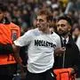A pitch invader is chased by security officers during the UEFA Champions League final football match between Borussia Dortmund and Real Madrid, at Wembley stadium, in London, on June 1, 2024. (Photo by Glyn KIRK / AFP)