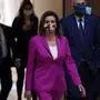House Speaker Nancy Pelosi walks past the Statuary Hall at the US Capitol on May 15, 2020 in Washington, DC - US House Democrats aim to pass a record $3 trillion coronavirus response package Friday to fund the fight against the pandemic and provide emergency payments to millions of US households. (Photo by Olivier DOULIERY / AFP)