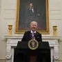 President Joe Biden arrives to speak about the coronavirus, accompanied by Vice President Kamala Harris, in the State Dinning Room of the White House, Thursday, Jan. 21, 2021, in Washington. (AP Photo/Alex Brandon)