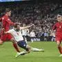 England's Harry Kane, center, attempts a shot at goal and saved by Denmark's goalkeeper Kasper Schmeichel during the Euro 2020 soccer semifinal match between England and Denmark at Wembley stadium in London, Wednesday, July 7, 2021. (Laurence Griffiths/Pool Photo via AP)