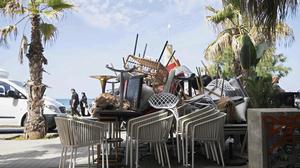 Chairs and tables from a collapsed building that killed four people are stacked in Palma de Mallorca