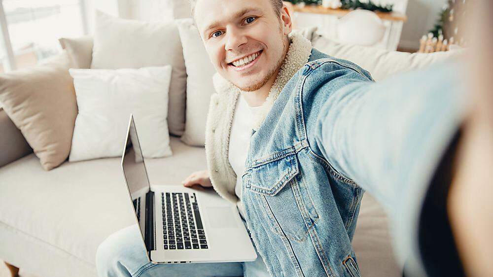 Business young man freelancer in quarantine for coronavirus working computer from home