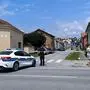 A police officer stands guard behind a police tape next to a retirement home (L) where at least five people were killed in a shooting in Daruvar, some 130km from Zagreb on July 22, 2024. At least five people were killed on July 22, 2024, in a retirement home in eastern Croatia, national television reported. According to initial reports in the local media, the suspect, a veteran born in 1973, entered the home and opened fire, reportedly killing his mother and four other residents and employees. He managed to escape, but was quickly arrested by the police in a nearby cafe, who declined to comment for the moment. (Photo by Nikola Blazekovic / AFP)