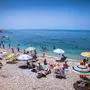 ATHENS, GREECE - JUNE 19, 2016: People on the beach in Palaio Faliro in Athens, Greece .