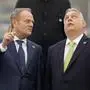 FILE - Hungary's Prime Minister Viktor Orban, right, speaks with Poland's Prime Minister Donald Tusk as they pose for a group photo during an Nuclear Energy Summit at the Expo in Brussels, on March 21, 2024. (AP Photo/Virginia Mayo, File)