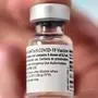 (FILES) This file photo taken on January 6, 2021, shows a vial of the Pfizer-BioNTech Covid-19 vaccine at the AP-HP Vaugirard hospital, in Paris. - The EU has concluded a deal with BioNTech/Pfizer for up to 1.8 billion extra doses of its Covid-19 vaccine, European Commission chief Ursula von der Leyen said on May 8, 2021. (Photo by BERTRAND GUAY / AFP)