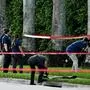 Members of FBI are seen at the crime scene outside the Trump International Golf Club in West Palm Beach, Florida, on September 15, 2024 following a shooting incident at former US president Donald Trump's golf course. Trump's campaign reported Sunday that there had been "gunshots in his vicinity" but added that the Republican presidential candidate was safe. (Photo by CHANDAN KHANNA / AFP)