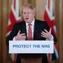 Britain's Prime Minister Boris Johnson addresses a news conference to give a daily update on the government's response to the novel coronavirus COVID-19 outbreak, inside 10 Downing Street in London on March 20, 2020. - Britain's government Friday rolled out a series of extra measures including direct grants to cover wages of employees who have been temporarily furloughed, as it ordered cafes, pubs and restaurants to close entirely. (Photo by JULIAN SIMMONDS / POOL / AFP)