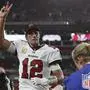 Tampa Bay Buccaneers quarterback Tom Brady (12) waves to spectators after an NFL football game between the Los Angeles Rams and Tampa Bay Buccaneers, Sunday, Nov. 6, 2022, in Tampa, Fla. The Buccaneers defeated the Rams 16-13. Brady become the first player in NFL history with over 100,000 career passing yards. (AP Photo/Mark LoMoglio)