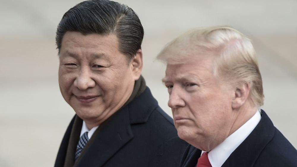 Chinass Präsident Xi Jinping (L) und US-Präsident Donald Trump 