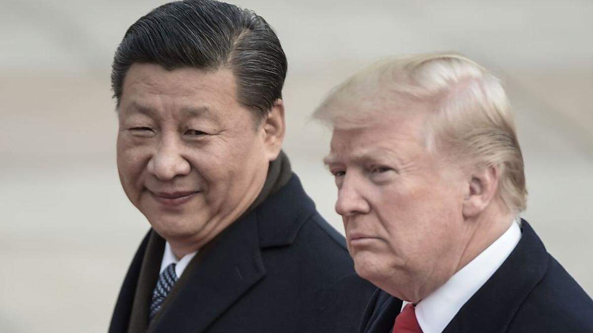 Chinass Präsident Xi Jinping (L) und US-Präsident Donald Trump 