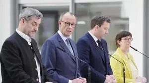 From left: Markus Soeder, chairman of Bavarians Christian Social Union party, Christian Democratic Union party chairman Friedrich Merz and the Social Democratic Party leaders Lars Klingbeil and Saskia Esken, attend a news conference in Berlin, Germany, Saturday, March 8, 2025. (AP Photo/Markus Schreiber)