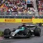 Mercedes' British driver George Russell races ahead of Red Bull Racing's Dutch driver Max Verstappen during the 2024 Canada Formula One Grand Prix at Circuit Gilles-Villeneuve in Montreal, Canada, on June 9, 2024. (Photo by CHARLY TRIBALLEAU / AFP)