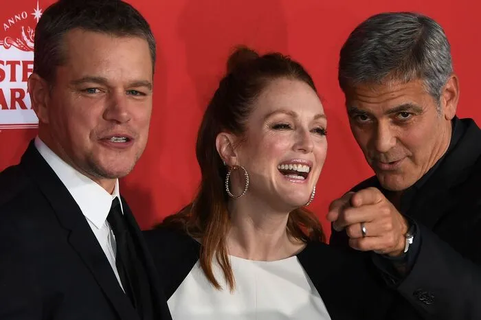 Clooney mit seinen Hauptdarstellern Matt Damon und Julianne Moore