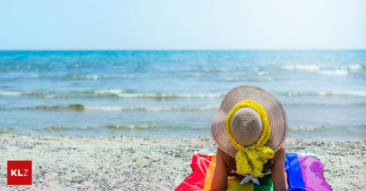 Gay Travel Index 2023 Malta Ist Das Beste Reiseziel F R Die LGBTQ   A Woman Sitting On Her Back On The Seashore On A Pride Flag She Is Wearing A Straw Hat And Yellow Scarf Lgtb Concept Of Diversity And Tolerance 1678467444669593 