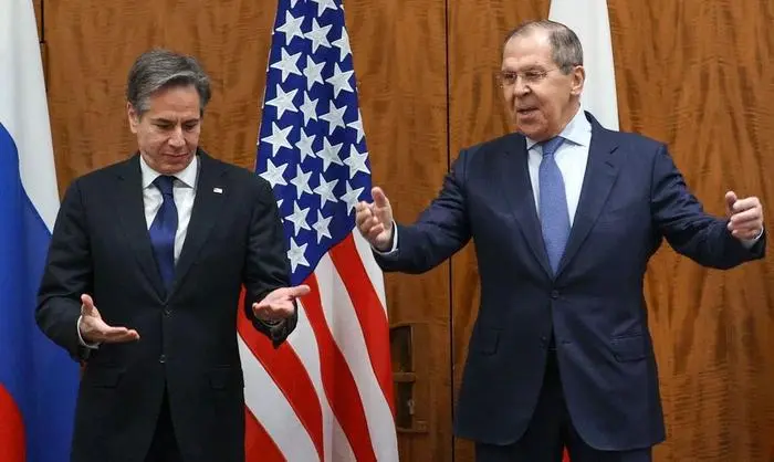 This handout photograph taken and released on January 21, 2022 by the Russian Foreign Ministry shows Russian Foreign Minister Sergei Lavrov (R) arriving to pose for pictures with US Secretary of State Antony Blinken during their meeting in Geneva. - Washington and Moscow's top diplomats met in Geneva for high-stakes talks on Ukraine, but with little hope of a breakthrough that would ease fears of a Russian invasion. The talks between Blinken and Lavrov come just 11 days after their deputies met in Geneva and agreed to preserve dialogue amid Russia's build-up of tens of thousands of troops on Ukraine's border. (Photo by Handout / RUSSIAN FOREIGN MINISTRY / AFP) / RESTRICTED TO EDITORIAL USE - MANDATORY CREDIT 