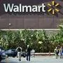 (FILES) In this file photo taken on January 29, 2014, shoppers are seen outside a Walmart store in Rosemead, California..Walmart on July 3, 2018, removed shirts and other gear from its online marketplace bearing the phrase "Impeach 45" after supporters of US President Donald Trump lambasted the retail giant on social media. / AFP PHOTO / Frederic J. BROWN