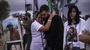 Two people embrace as relatives and supporters of Israelis killed in the October 7 Hamas attack attend a ceremony at the Nova memorial near Kibbutz Reim in southern Israel on the first anniversary of the attacks, October 7, 2024. Thousands of people gathered over the weekend for the first emotional commemorations marking the anniversary of Palestinian militant group Hamas's October 7, 2023 attack on Israel.
The first candlelight vigils, memorials and marches to mark the anniversary were held in cities ranging from Tel Aviv to London, Paris and Berlin, with more set to be held around the world on Monday. (Photo by JOHN WESSELS / AFP)