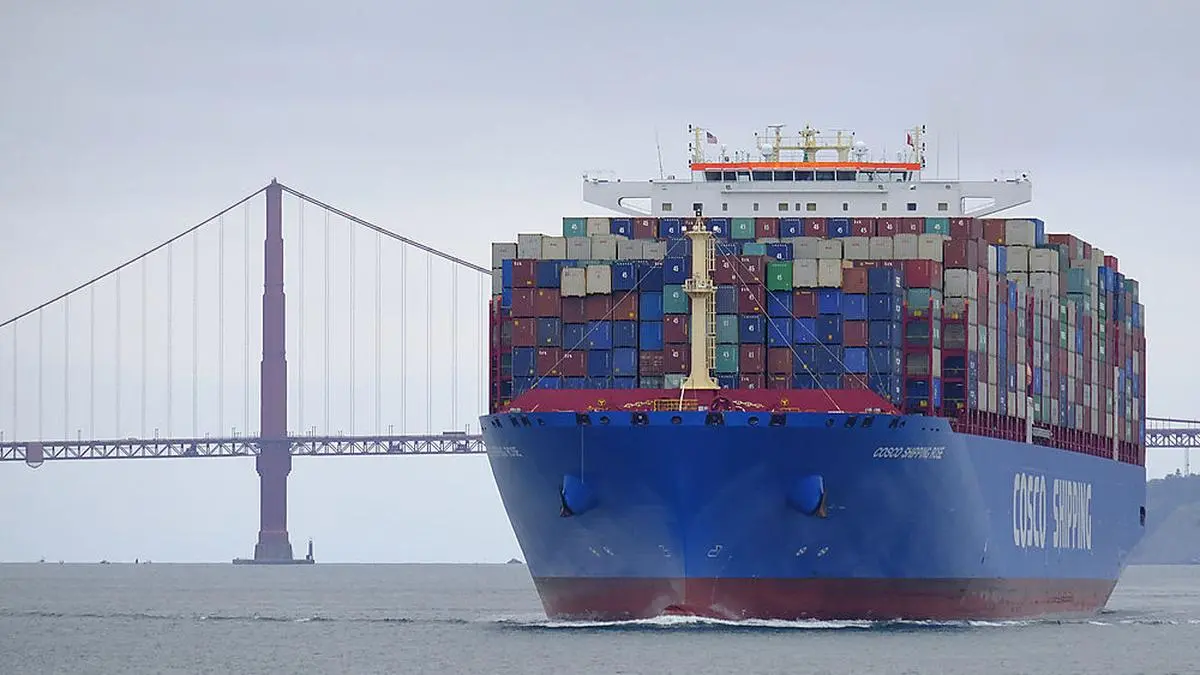 FILE - In this Tuesday, May 14, 2019 file photo, a Cosco Shipping container ship passes the Golden Gate Bridge in San Francisco bound for the Port of Oakland. The United States and China are raising tariffs on tens of billions of dollars' worth of each other's imports, escalating a trade war, spooking financial markets and casting gloom over the prospects for the world economy. (AP Photo/Eric Risberg)
