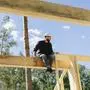 Engineer sitting on wooden frame at construction site model released, Symbolfoto property released, SEAF02048