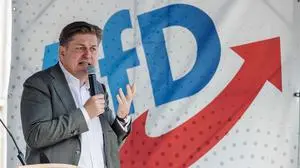 (FILES) Top candidate of German right-wing Alternative for Germany (AfD) party for the European election Maximilian Krah speaks during a campaign event for the upcoming European elections in Dresden, eastern Germany on May 1, 2024. A German court in Dresden, eastern Germany, will on August 5, 2025 begin the trial of two suspected spies for China, one of whom worked as assistant for controversial far-right lawmaker Maximilian Krah. One of the defendants, a German national named by prosecutors as Jian G., is suspected of working with Chinese intelligence since 2002, including while he was an aide to the Alternative for Germany (AfD) MEP Krah between 2019 and 2024. (Photo by JENS SCHLUETER / AFP)