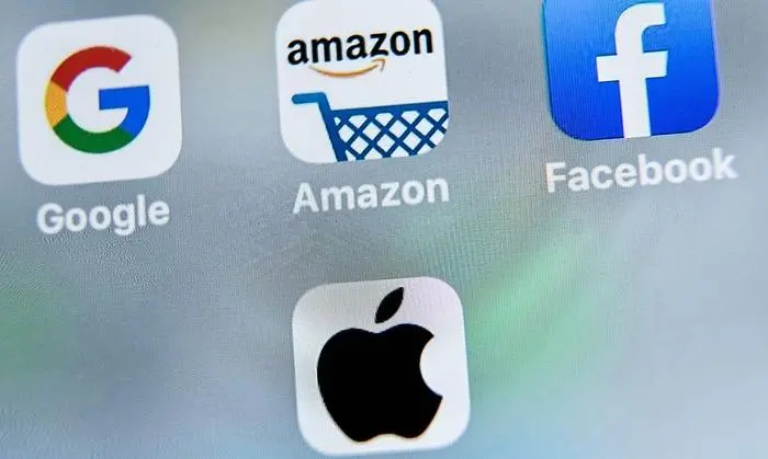 (FILES) This file photo taken on August 28, 2019 shows the US multinational technology and Internet-related services company Google logo (top L), US online store application Amazon (top C), US online social media and social networking service, Facebook (top R) and   US multinational technology company Apple logo  application (down C) displayed on a tablet in Lille. - Big Tech is bracing for a tumultuous week marked by quarterly results likely to show resilience despite the pandemic, and fresh attacks from lawmakers ahead of the November 3 election. With backlash against Silicon Valley intensifying, the companies will seek to reassure investors while at the same time fend off regulators and activists who claim these firms have become too dominant and powerful. (Photo by DENIS CHARLET / AFP)