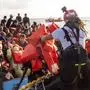 Migrants are rescued from the sea some 30 miles off Libya by the members of the humanitarian ship Geo Barents, Friday, Oct. 6, 2023. Badly advised by relatives and friends, misled by insufficient official information or poor translation services, many can end up in legal limbo for years, cut off from any government aid. (AP Photo/Paolo Santalucia)