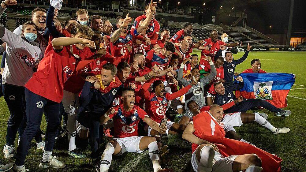 LOSC Lille s team celebrate the win against Angers SCO during the French championship Ligue 1 football match between Lil