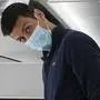 FILE - Recently deported from Australia for not being vaccinated against COVID-19, Novak Djokovic prepares to take his seat on a plane to Belgrade, in Dubai, United Arab Emirates, Monday, Jan. 17, 2022. Three Australian Federal Court judges on Thursday, Jan. 20, 2022, revealed their reasons for backing a government order to deport tennis star Novak Djokovic, explaining they did not consider the “merits or wisdom of the decision.” (AP Photo/Darko Bandic, File)