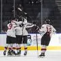 Austria celebrates a goal against Switzerland during the second period of an IIHF world junior hockey championships game Monday, Aug. 15, 2022, in Edmonton, Alberta. (Jason Franson/The Canadian Press via AP)