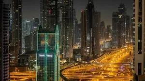 The empty Sheikh Zayed Road is made ready for the early morning start of the "Dubai Run 2025" as part of the 9th Edition of Dubai Fitness Challenge, in Dubai on November 23, 2025. (Photo by FADEL SENNA / AFP)