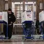 Voters cast their ballot during early voting in the Bronx Borough of New York City on November 1, 2024. (Photo by David Dee Delgado / AFP)