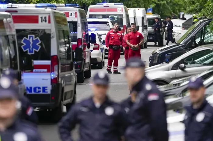Police block streets around the Vladislav Ribnikar school in Belgrade, Serbia, Wednesday, May 3, 2023. A teenage boy opened fire early Wednesday in a school in central Belgrade, causing injuries. (AP Photo/Darko Vojinovic)