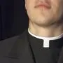 Close-up of Priest collar with black background.