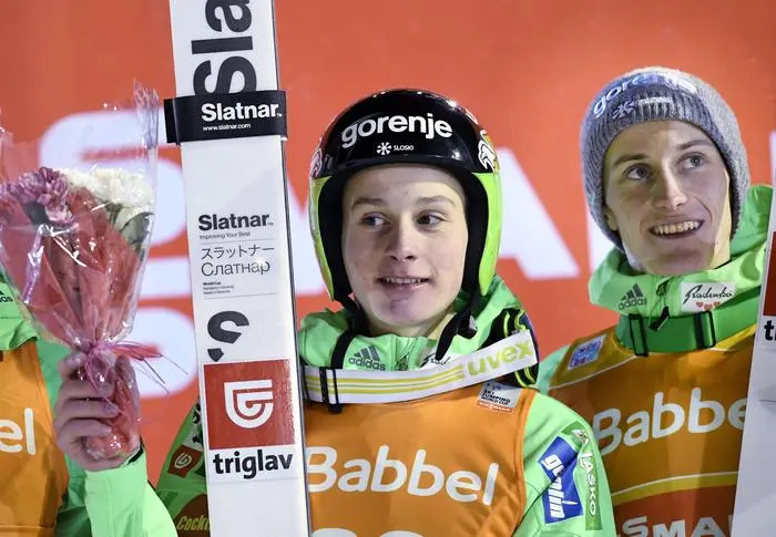 Winner Domen Prevc, left, of Slovenia pose on the podium with his brother Peter Prevc who came third in the Ski Jumping Large Hill (HS142) event at FIS Ruka Nordic 2016 World Cup season opening in Kuusamo, Finland, on Friday Nov. 25, 2016. (Martti Kainulainen/Lehtikuva via AP)  FINLAND OUT - NO SALES
