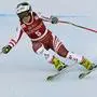 Austria's Nicole Schmidhofer speeds down the course during an alpine ski, women's World Cup downhill training, in Val d'Isere, France, Thursday, Dec.17, 2020. (AP Photo/Giovanni Auletta)