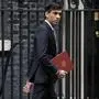 FILE  - British Chancellor of the Exchequer Rishi Sunak leaves number 11 Downing Street, to deliver a financial announcement to the Houses of Parliament in London, Wednesday, July 8, 2020. Sunak ran for Britain’s top job and lost. Now he’s back with a second chance to become prime minister. (AP Photo/Matt Dunham, File)