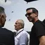 Red Bull owner Mark Dietrich Mateschitz, center, stands with team members Helmut Marko, center, and Christian Horner in the paddock ahead of the Austrian Formula One Grand Prix race at the Red Bull Ring racetrack in Spielberg, Austria, Sunday, June 30, 2024. (AP Photo/Christian Bruna)
