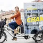 Wahlplakat am Lastenrad: Judith Schwentner will für die Grünen Grazer Bürgermeisterin werden