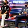 Mercedes' British driver Lewis Hamilton (L) and Red Bull's Dutch driver Max Verstappen attend a press conference after the Formula One United States Grand Prix at the Circuit of The Americas in Austin, Texas, on October 24, 2021. - Max Verstappen held off a charging Lewis Hamilton to win the United States Grand Prix on Sunday and extend his Formula One world championship lead to 12 points. (Photo by Zak Mauger / POOL / AFP)