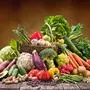 Assortment of fresh organic vegetables and fruits in wicker basket. Selection of organic food for healthy nutrition