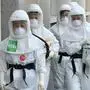 South Korean nurses wearing protective gear arrive for their shift to care for patients infected with the COVID-19 coronavirus at Keimyung University Daegu Dongsan Hospital in Daegu on April 29, 2020. - South Korea once had the largest outbreak outside China, where the disease first emerged, but appears to have brought it under control with an extensive "trace, test and treat" programme. (Photo by Jung Yeon-je / AFP)